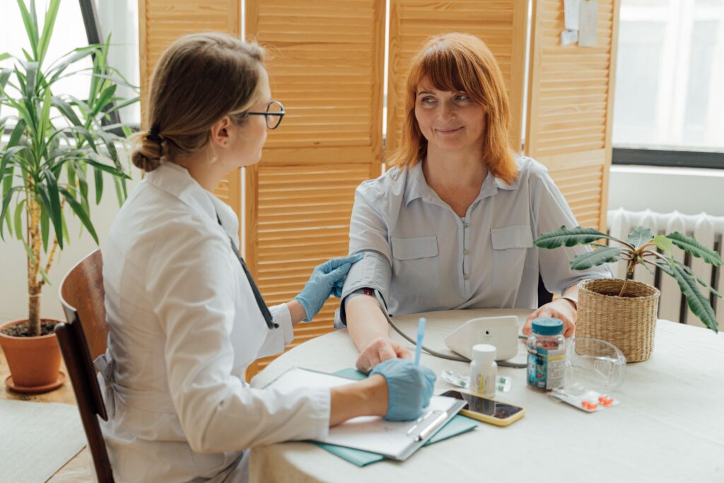 Family discussing skilled nursing and personal care options with a healthcare professional.